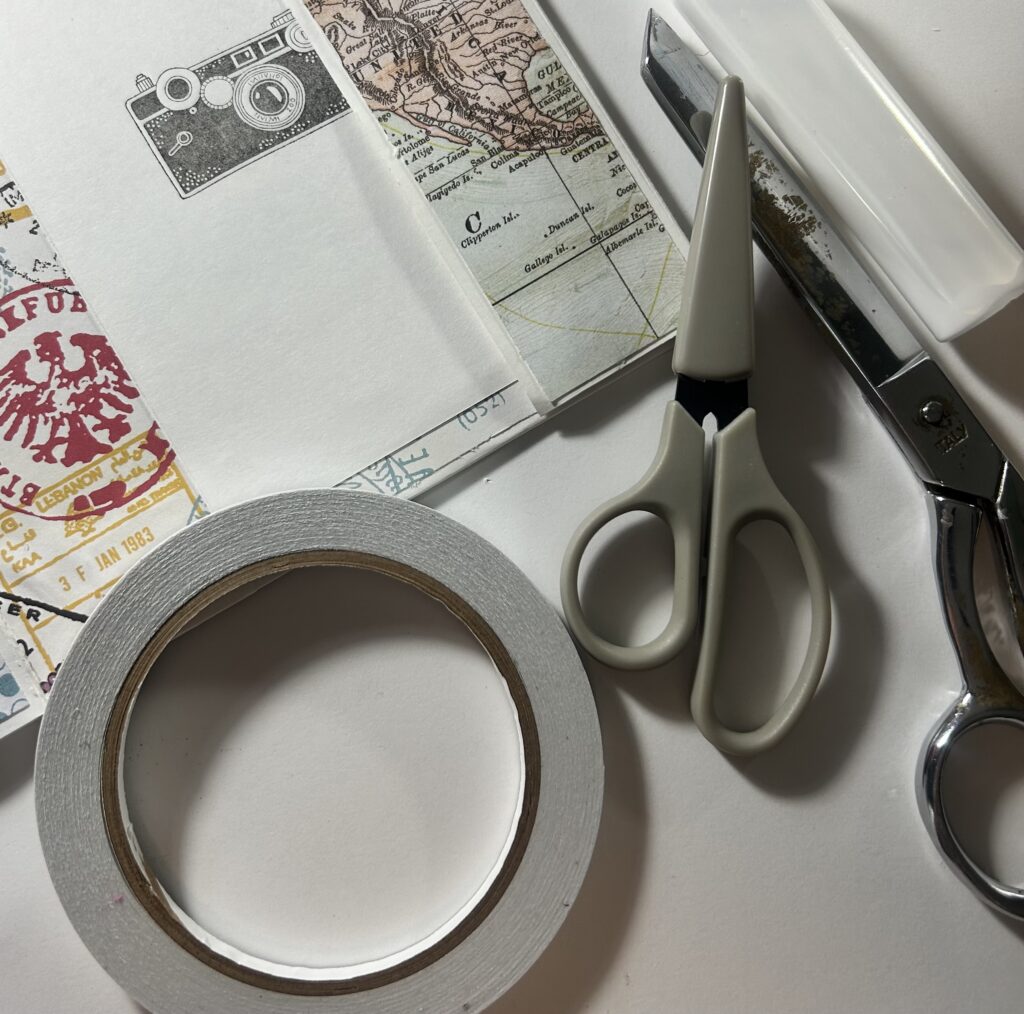 scrapbooking supplies with tape and scissors image