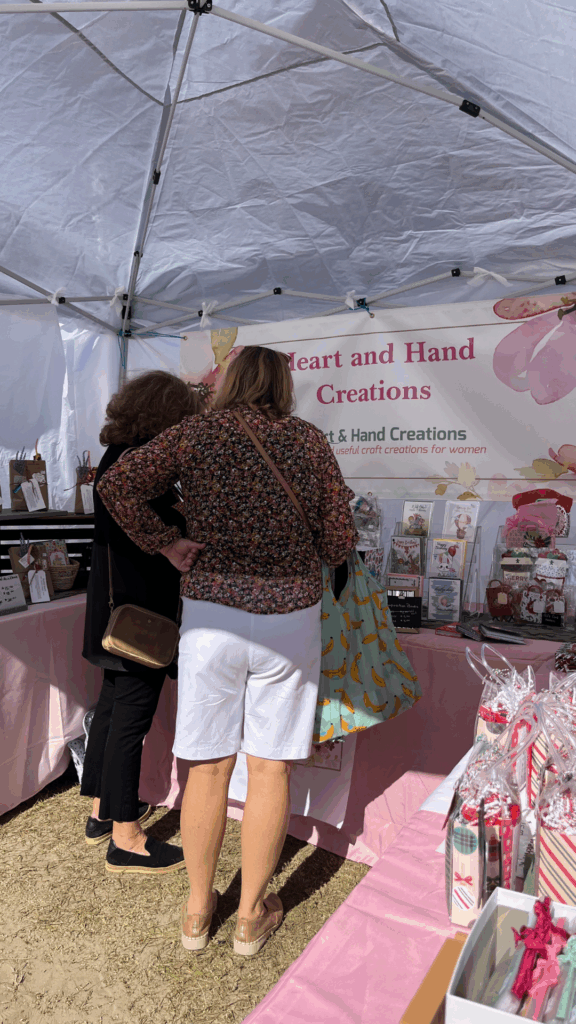 Customers visiting my vendor tent at the Annual Holiday Market in 2025. 